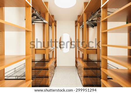 wide wooden dressing room, interior of a modern house