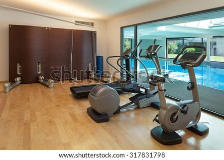 Interior, gym of a modern house with spa