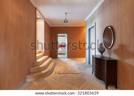Grand corridor with parquet floor in luxury mansion