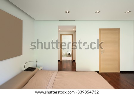 Interior of modern house, comfortable bedroom