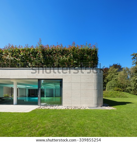 Modern house, garden with indoor pool, outdoors