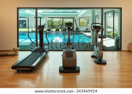 Interior, gym of a modern house with spa