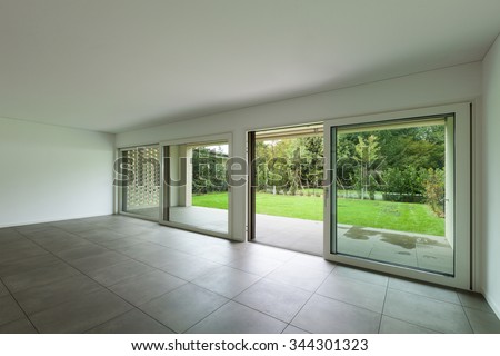 interior of new apartment, empty hall with window, tiled floor