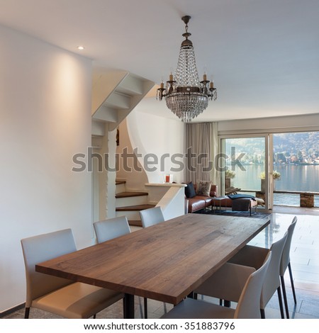 Interior of house, dining room with wooden table