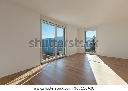 interior of a modern apartment, empty room and view from the windows