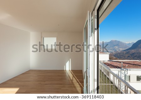 interior of a modern apartment, empty room and view from the window
