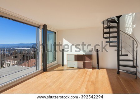 Interior, wide open space of a duplex, large window