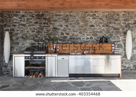 House, modern kitchen with barbecue on the veranda