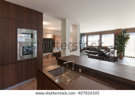 Interiors of new apartment, wooden kitchen modern design