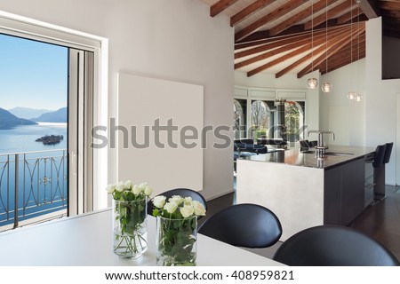 Interior of a loft, wide open space, dining table modern design