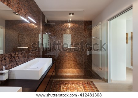 Interiors of new apartment, bathroom, tiled walls
