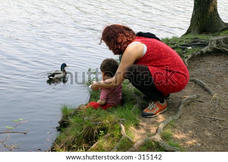 woman and son at water\'s edge