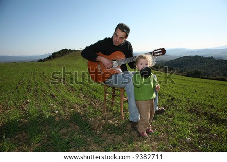 father daughter and guitar