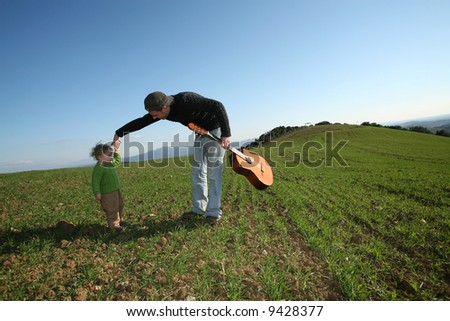 father daugther and guitar
