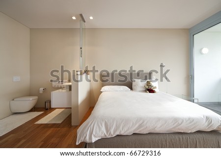 Modern Apartment Interior View Bedroom And Bathroom Stock Photo