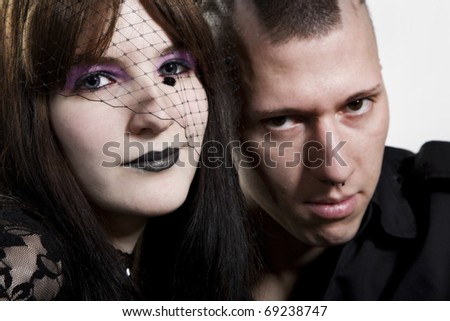 Close-up of a couple punk on white background