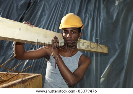 young black man working in construction site