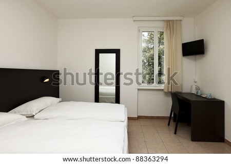 simple hotel room, double bed
