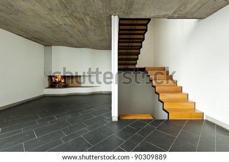 modern empty villa, room  fireplace and wooden staircase