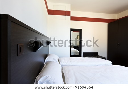 simple hotel room,  double bed
