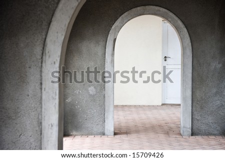 Mysterious door seen through arches - landscape exterior