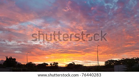 Spectacular sunset over urban area - landscape exterior