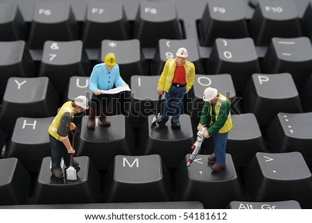 Men At Work on Computer Keyboard