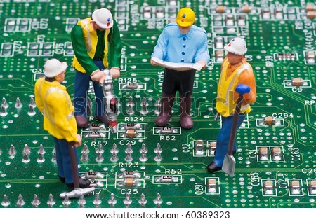 Engineers Fixing Computer Circuit Board
