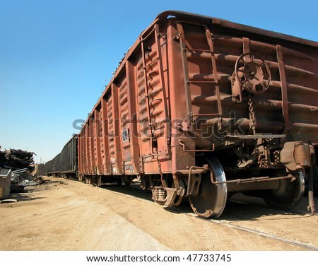Junkyard freight train car on tracks