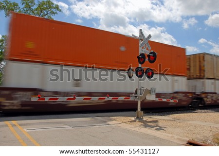 Freight train at crossing gate
