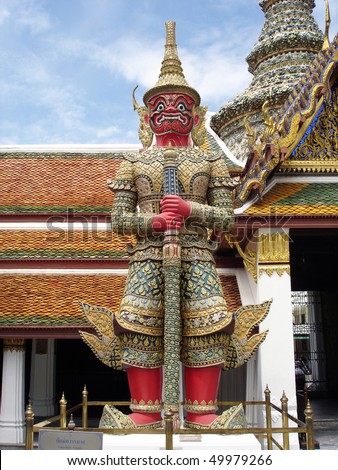 Huge demon is standing in front of a buddhist monastery to make the bad spirits go away, Bangkok, Thailand