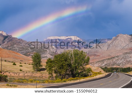 Rainbow over the road leading to Bighorn National Forest