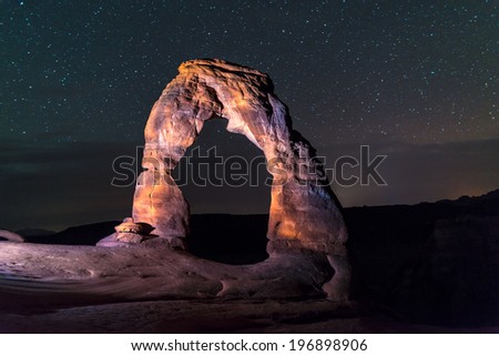 Famous Utah Landmark Delicate arch photographed at night with clean skies and shooting stars