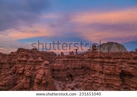 Bird\'s eye view of the Goblin Valley at Sunset with colorful sky above