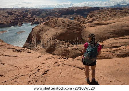 Hiker Backpacker looking at Lake Powell Horizontal Composition
