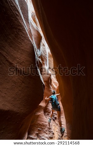 Girl Climbing in Spooky Gulch Short Canyon Grand Staircase-Escalante