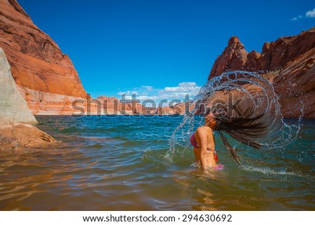 Bikini Woman taking a relaxing bath in the Lake Powell Horizontal Composition