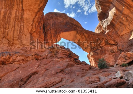 High Dynamic Range Photo of a Double Arch against blue sky-  Moab Utah