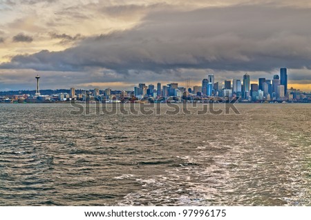Seattle Skyline with dramatic stormy sky  taken from the auto ferry