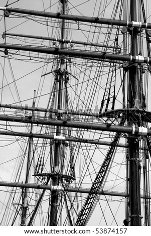 Old Looking Black and White Image of Historic Ship Masts and Rigging.