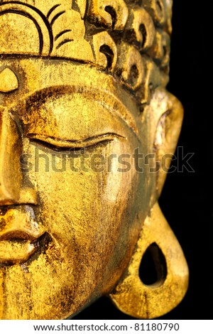 Beautiful Golden Buddha\'s Head Mask on Black View of Side.