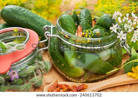 preserved cucumbers on the wooden table