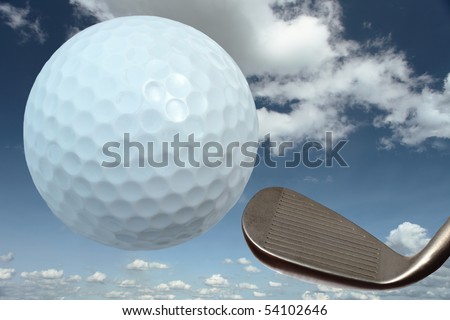 Golf ball and iron against a cloudy blue sky