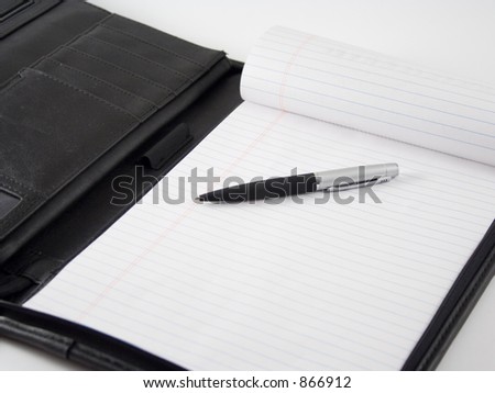 Pen and Pad of Paper in Portfolio
