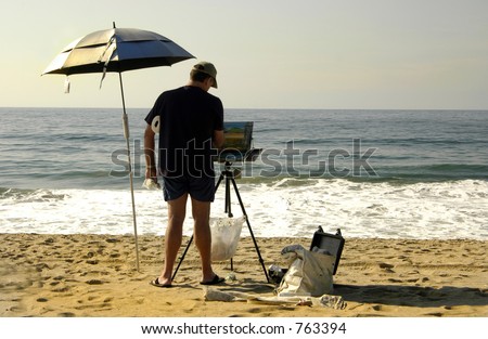 Painter takes advantage of the beach