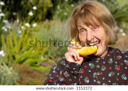 Older woman talks into banana instead of phone
