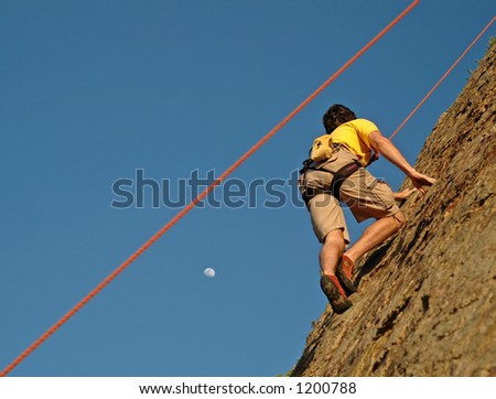 Climber climbs up California Cliff at Sunset and moon rise