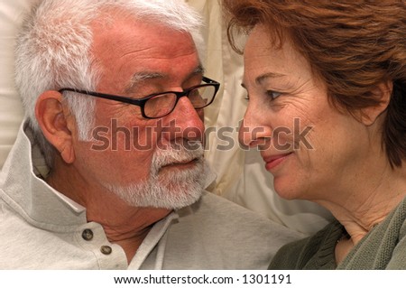 Man and woman share a private bedroom moment