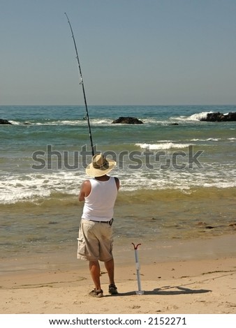 A man fishes in the ocean