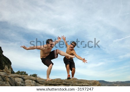 Two guys goofing around at the beach